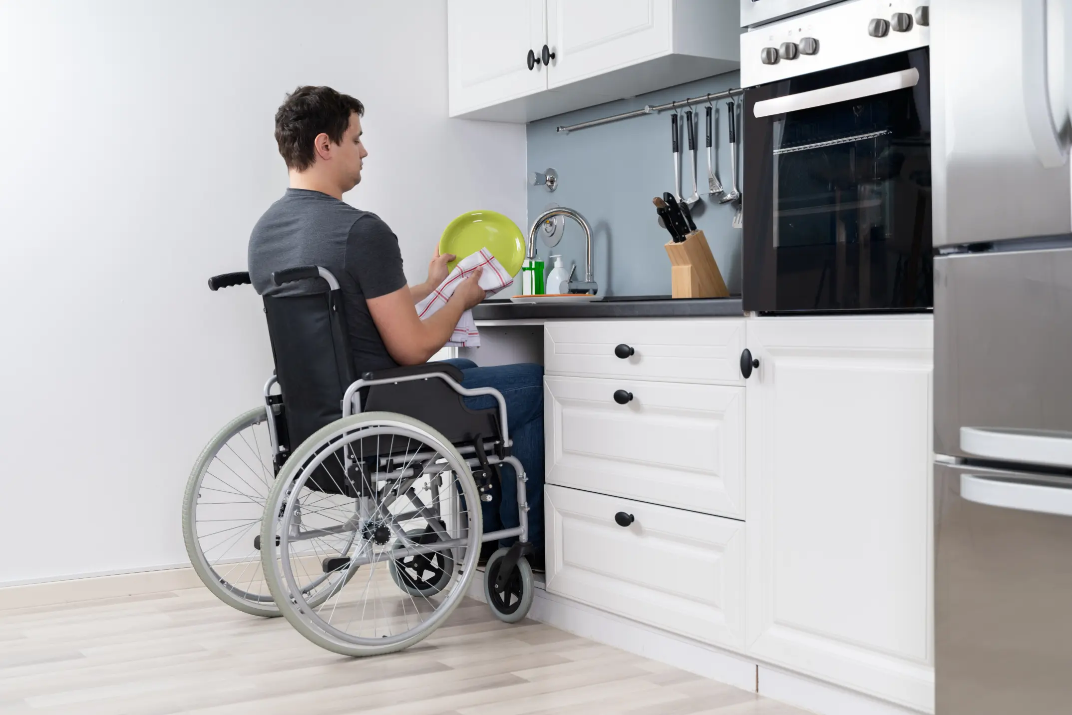 Handicapped Man Washing Dishes